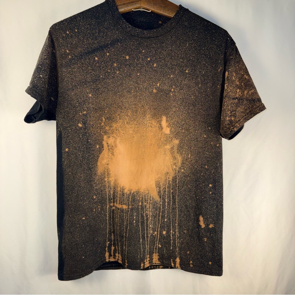 Brown and black shirt with the word, boo on the back